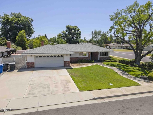 6000 Eugene Pl, Bakersfield, CA 93308 - single story home with brick siding, a garage, concrete driveway, and a gate