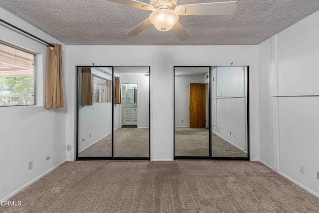 6000 Eugene Pl, Bakersfield, CA 93308 - unfurnished bedroom with carpet floors, two closets, a textured ceiling, and a ceiling fan
