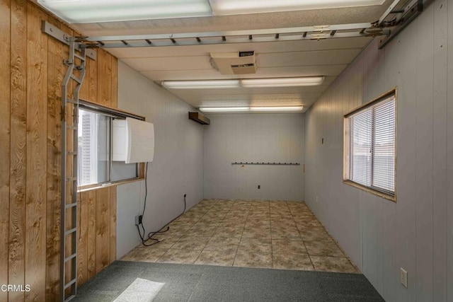 6000 Eugene Pl, Bakersfield, CA 93308 - unfurnished room with plenty of natural light and wood walls