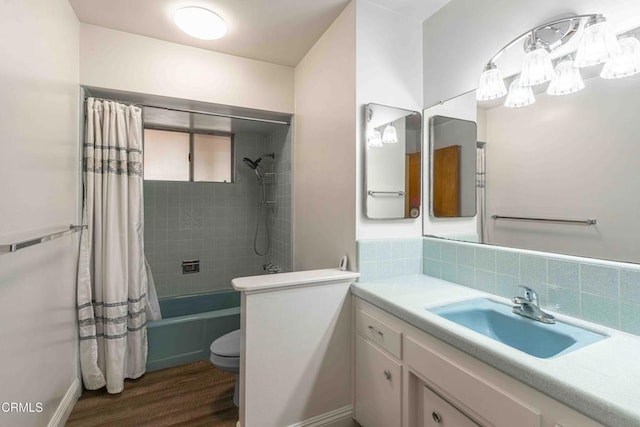 6000 Eugene Pl, Bakersfield, CA 93308 - bathroom featuring shower / bath combination with curtain, vanity, wood finished floors, and tasteful backsplash