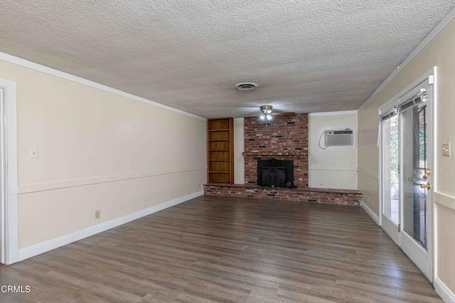 6000 Eugene Pl, Bakersfield, CA 93308 - unfurnished living room featuring wood finished floors, an AC wall unit, a textured ceiling, and crown molding