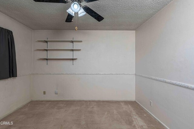 6000 Eugene Pl, Bakersfield, CA 93308 - carpeted empty room featuring a ceiling fan and a textured ceiling