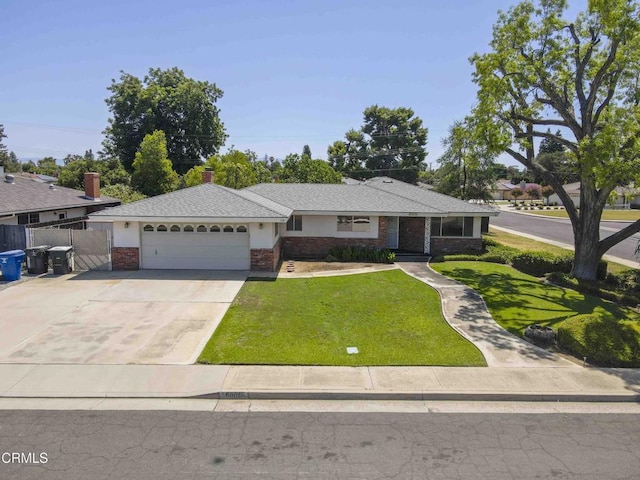 6000 Eugene Pl, Bakersfield, CA 93308 - single story home featuring a garage, a front yard, brick siding, and driveway