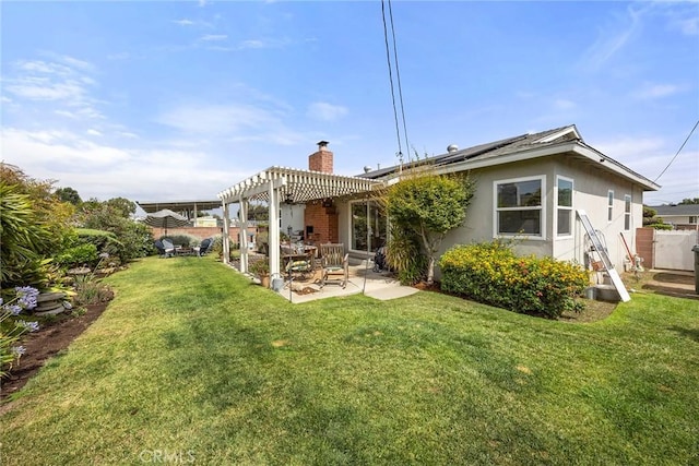 1642 W Woodcrest Ave, Fullerton, CA 92833 - back of house featuring a pergola, a patio area, solar panels, stucco siding, and a chimney