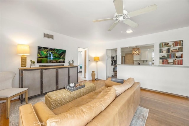 1642 W Woodcrest Ave, Fullerton, CA 92833 - living area featuring light wood-style flooring and a ceiling fan