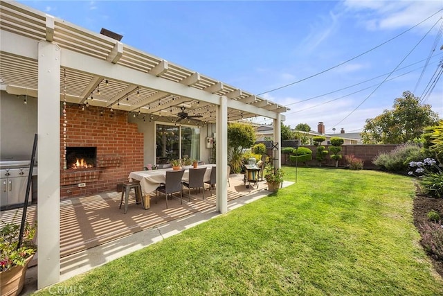 1642 W Woodcrest Ave, Fullerton, CA 92833 - view of yard featuring a pergola, an outdoor brick fireplace, a patio area, and ceiling fan