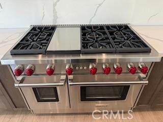 20552 Edgewood Ct, Chatsworth, CA 91311 - kitchen view of double oven range and light wood finished floors