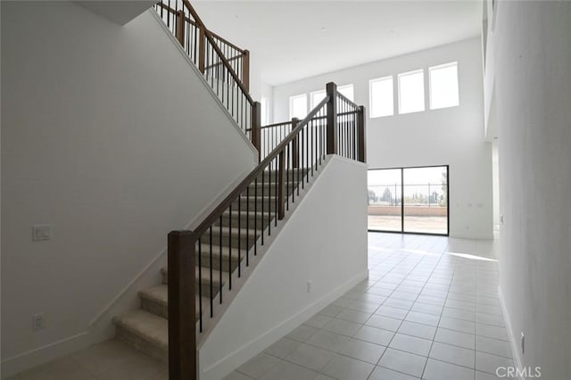 20552 Edgewood Ct, Chatsworth, CA 91311 - staircase with a high ceiling and tile patterned flooring