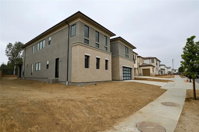 20552 Edgewood Ct, Chatsworth, CA 91311 - view of building exterior with driveway and an attached garage