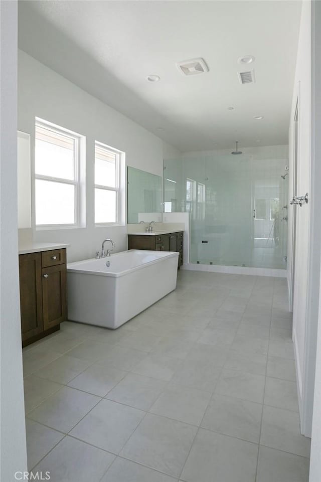 20552 Edgewood Ct, Chatsworth, CA 91311 - bathroom featuring a shower stall, a freestanding bath, vanity, and tile patterned flooring