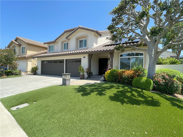17 Thornbird, Aliso Viejo, CA 92656 - mediterranean / spanish-style house with an attached garage, a tile roof, driveway, stucco siding, and a front lawn