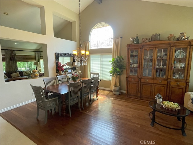 17 Thornbird, Aliso Viejo, CA 92656 - dining room featuring high vaulted ceiling, wood finished floors, healthy amount of natural light, and a chandelier