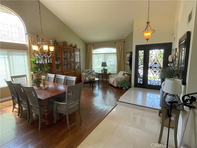 17 Thornbird, Aliso Viejo, CA 92656 - dining room featuring a chandelier, high vaulted ceiling, and light wood finished floors