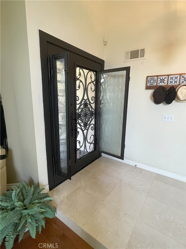 17 Thornbird, Aliso Viejo, CA 92656 - tiled foyer entrance featuring baseboards