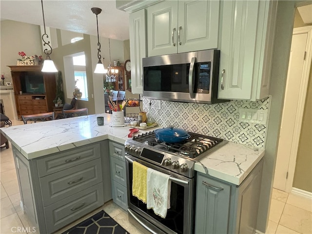 17 Thornbird, Aliso Viejo, CA 92656 - kitchen featuring appliances with stainless steel finishes, a peninsula, gray cabinets, backsplash, and light stone counters