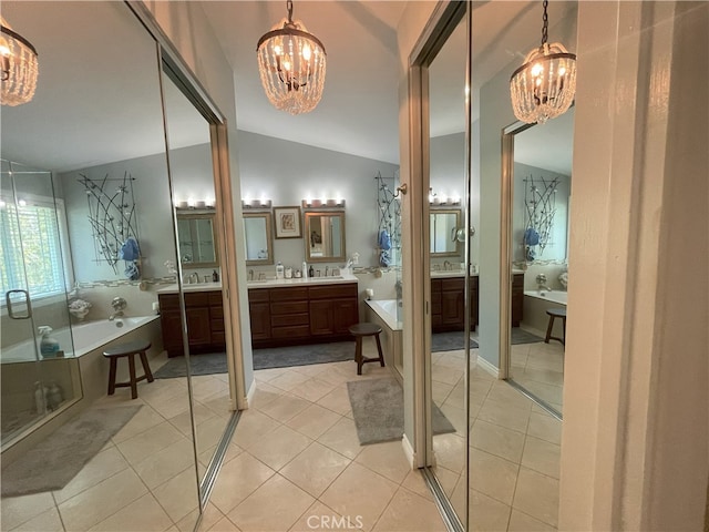 17 Thornbird, Aliso Viejo, CA 92656 - full bath featuring a chandelier, a bath, two vanities, and lofted ceiling