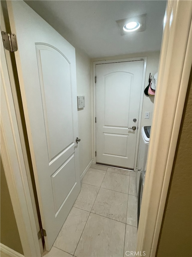 17 Thornbird, Aliso Viejo, CA 92656 - doorway featuring light marble finish floors and baseboards