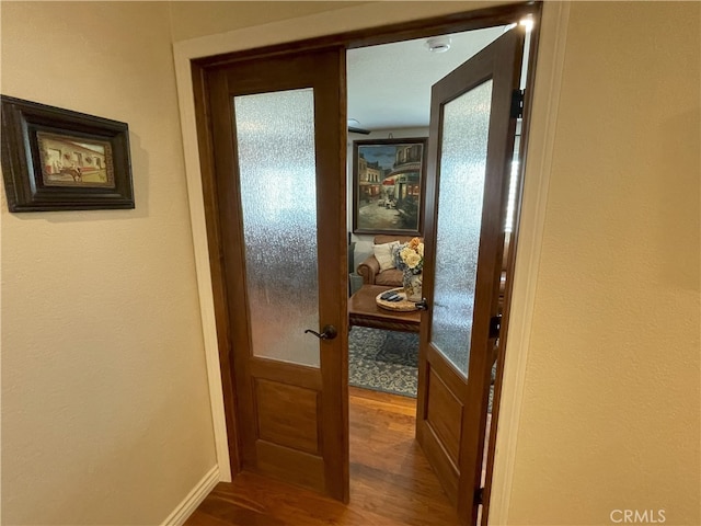 17 Thornbird, Aliso Viejo, CA 92656 - hallway featuring dark wood-type flooring and french doors