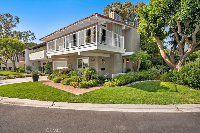 362 Vista Madera, Newport Beach, CA 92660 - view of front of home with a balcony, stucco siding, an attached garage, a chimney, and a front yard