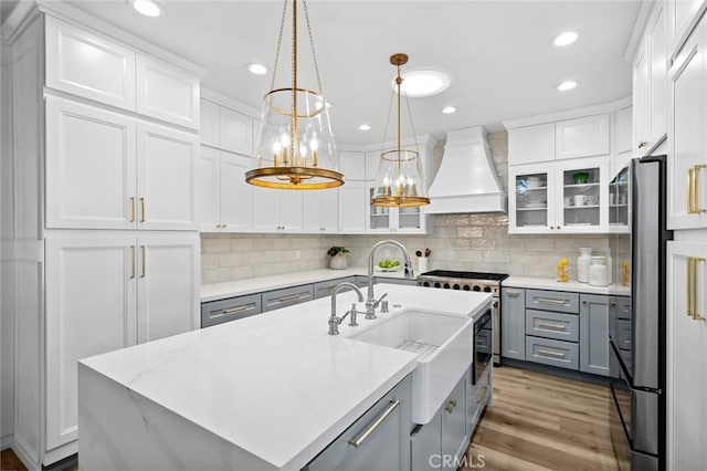 362 Vista Madera, Newport Beach, CA 92660 - kitchen with custom range hood, gray cabinets, appliances with stainless steel finishes, white cabinets, and recessed lighting