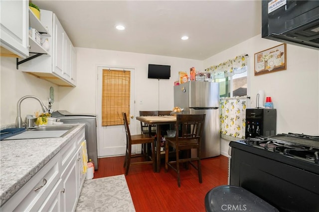4220 W 165th St, Lawndale, CA 90260 - kitchen featuring freestanding refrigerator, black range with gas stovetop, dark wood-style flooring, white cabinets, and recessed lighting