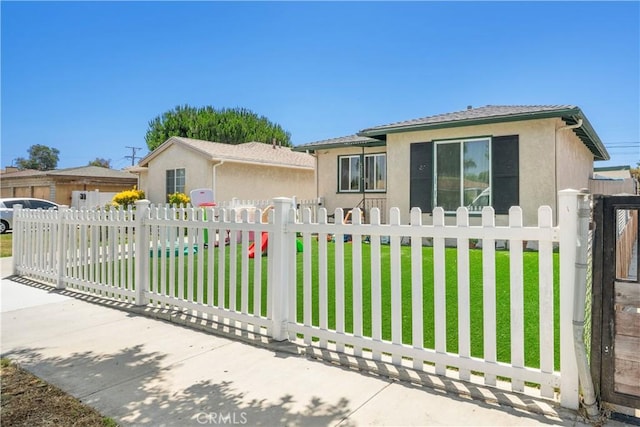 4220 W 165th St, Lawndale, CA 90260 - view of front of property with stucco siding, a fenced front yard, and a gate
