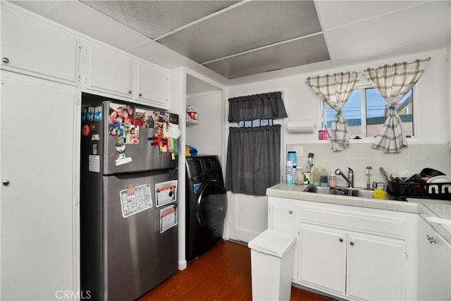 4220 W 165th St, Lawndale, CA 90260 - kitchen featuring freestanding refrigerator, washer / clothes dryer, white cabinets, tile counters, and tasteful backsplash