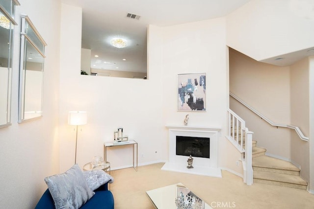 159 Principia Ct, Claremont, CA 91711 - living area with carpet, stairway, and a glass covered fireplace
