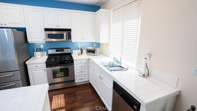 159 Principia Ct, Claremont, CA 91711 - kitchen featuring stainless steel appliances, tile countertops, white cabinets, and dark wood-type flooring