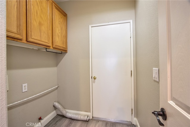 41808 Vardon Dr, Temecula, CA 92591 - washroom featuring cabinet space and wood finished floors