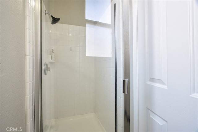 41808 Vardon Dr, Temecula, CA 92591 - bathroom featuring a shower stall and a textured wall