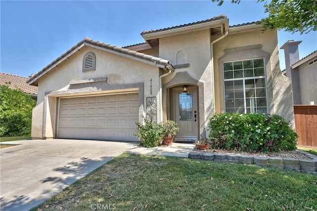 41808 Vardon Dr, Temecula, CA 92591 - mediterranean / spanish-style home featuring an attached garage, stucco siding, driveway, a tiled roof, and a front lawn