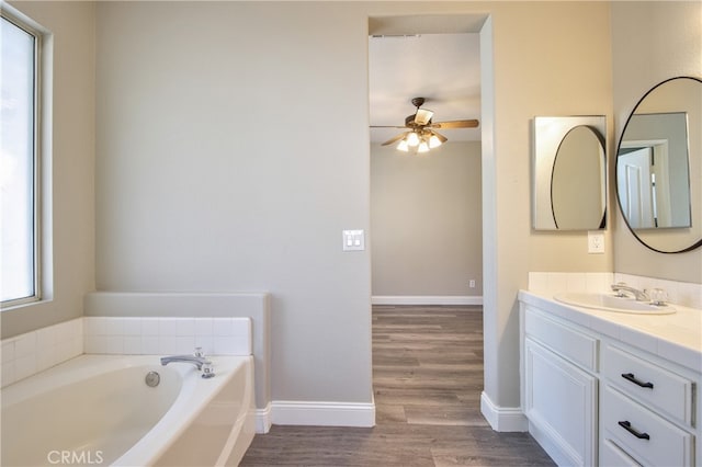 41808 Vardon Dr, Temecula, CA 92591 - bathroom featuring vanity, a ceiling fan, wood finished floors, and a bath