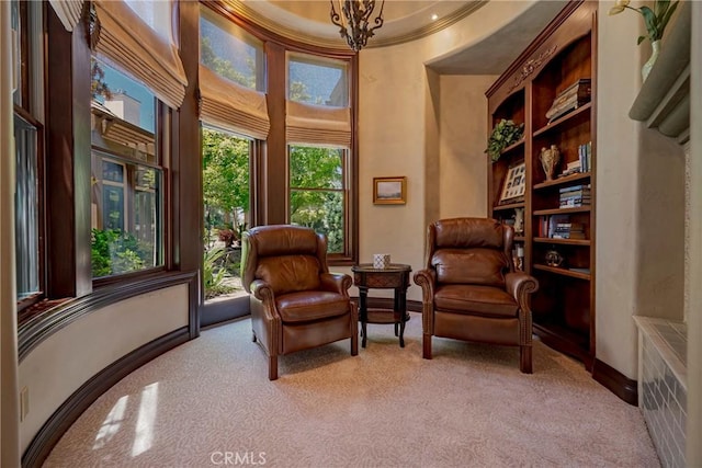 2882 Trovare Ct, Merced, CA 95340 - sitting room with light colored carpet, a towering ceiling, and crown molding