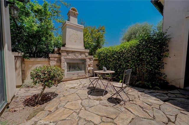 2882 Trovare Ct, Merced, CA 95340 - view of patio with an outdoor stone fireplace
