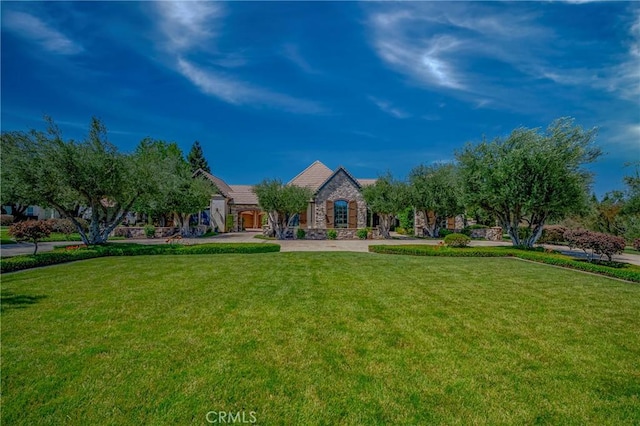 2882 Trovare Ct, Merced, CA 95340 - view of front of property featuring stone siding and a front yard