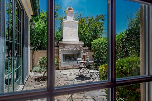 2882 Trovare Ct, Merced, CA 95340 - doorway featuring an outdoor stone fireplace