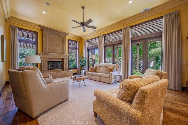 2882 Trovare Ct, Merced, CA 95340 - living room featuring ornamental molding, a ceiling fan, a fireplace, recessed lighting, and wood finished floors