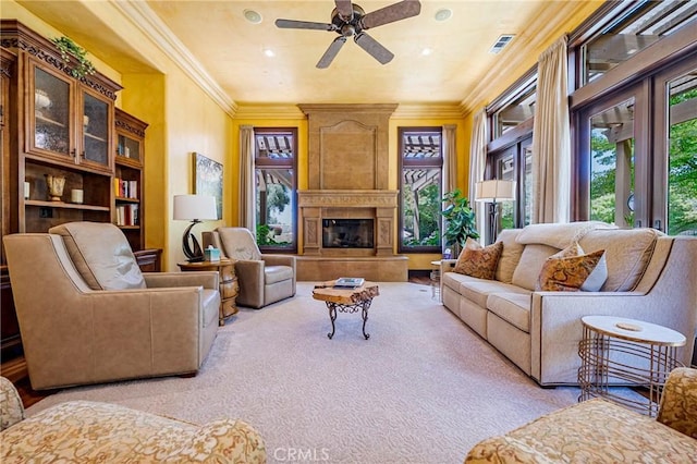 2882 Trovare Ct, Merced, CA 95340 - living room with carpet, ceiling fan, crown molding, and a high end fireplace