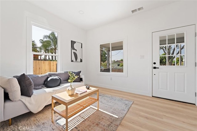 2158 10th St, Riverside, CA 92507 - living room with healthy amount of natural light and light wood finished floors