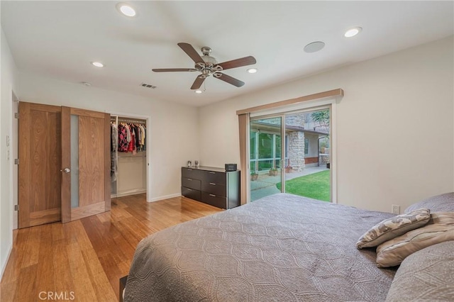 4510 S Mullen Ave, View Park, CA 90043 - bedroom with access to exterior, light wood-style flooring, recessed lighting, a walk in closet, and a ceiling fan