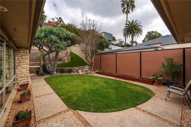 4510 S Mullen Ave, View Park, CA 90043 - fenced backyard with a patio area