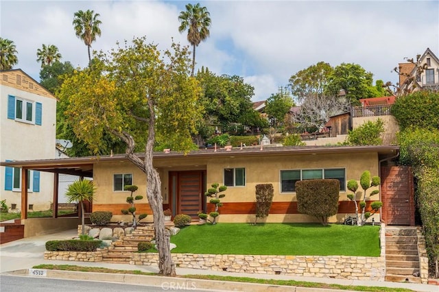 4510 S Mullen Ave, View Park, CA 90043 - view of front facade with a front lawn, stairway, and stucco siding