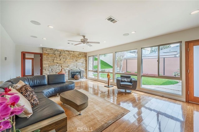 4510 S Mullen Ave, View Park, CA 90043 - living room featuring recessed lighting, hardwood / wood-style floors, ceiling fan, and a stone fireplace