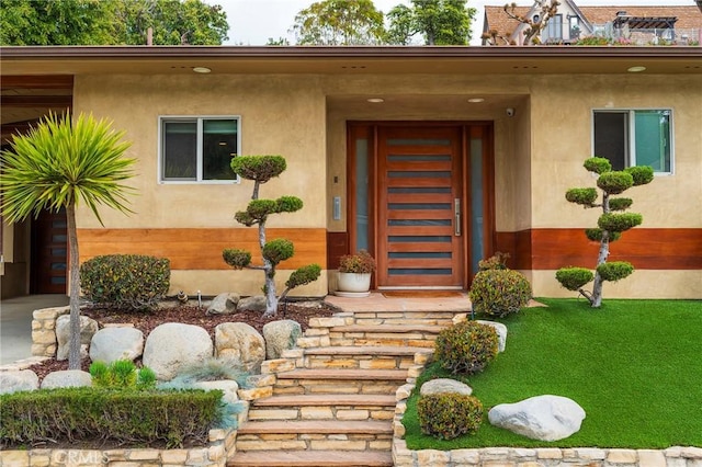 4510 S Mullen Ave, View Park, CA 90043 - view of exterior entry featuring stucco siding