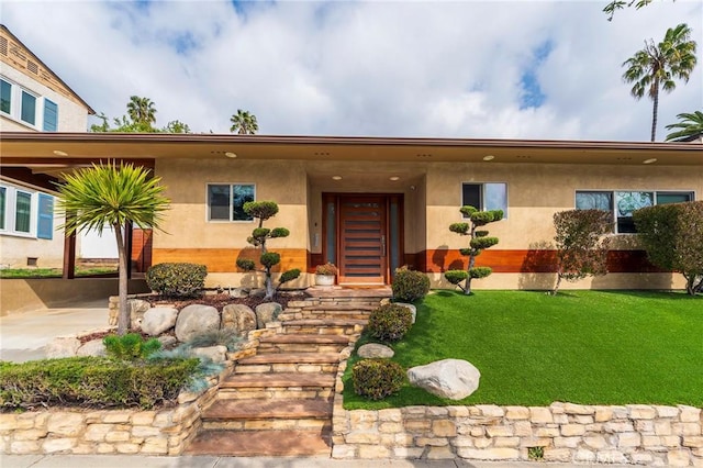 4510 S Mullen Ave, View Park, CA 90043 - view of front facade with a front lawn and stucco siding