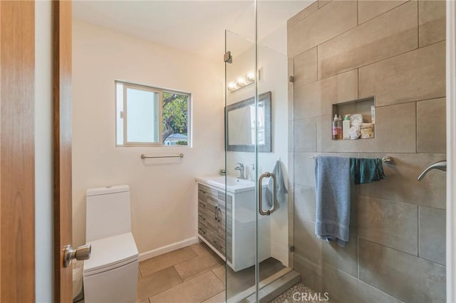 4510 S Mullen Ave, View Park, CA 90043 - bathroom featuring a shower stall, vanity, and tile patterned flooring