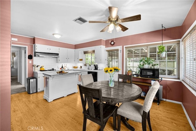 1210 W Marshall Blvd, San Bernardino, CA 92405 - dining room with a ceiling fan and light wood-style floors