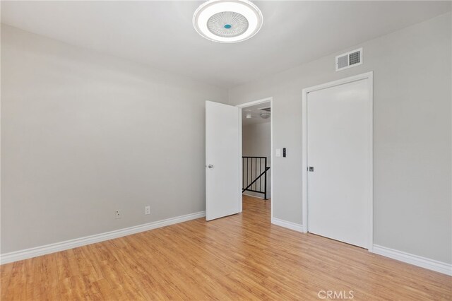 2621 E 20th St Unit 12, Signal Hill, CA 90755 - empty room featuring light wood-style floors and baseboards