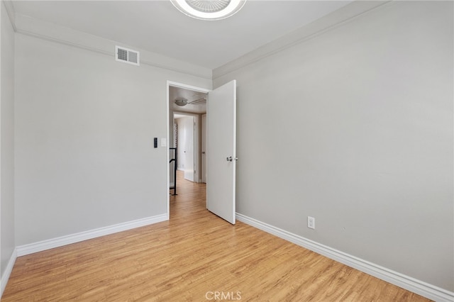 2621 E 20th St Unit 12, Signal Hill, CA 90755 - unfurnished room featuring light wood finished floors and crown molding